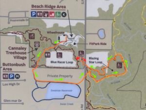 Annotated Beach Ridge trail map showing an orange walking route from the Wheelhouse past Cannaley Treehouse Village and Swanton Reservoir into Blazing Star Loop, ending at a red star.
